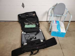 lot 20A image: Saunders Lumbar Traction Device and Folding Commode