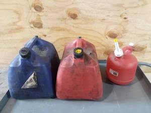lot 161 image: (3) Plastic Fuel  Gas Cans (2) 5 Gallon and (1) 1.25 Gallon