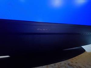 Flat screen TV with built in stereo speakers.
