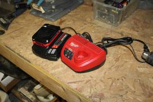lot 44 image: Lot of (2) Cordless Tool Accessories - Craftsman Charging Station V20 Lithium Ion with Battery, Milwaukee Charging Station M12 without Battery