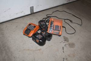 lot 40 image: Lot of (5) Ridgid Cordless Tool Accessories - Charging Stations (x2), Batteries (x3)