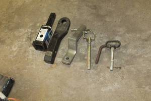 lot 103 image: Lot of (6) Trailer Hitch Parts and Accessories - Tow Smart Receiver Adapter 3500lb, Draw-Tite 3500lb, Hitch Attachment, Hitch Pins (x3)