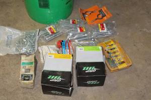 lot 197 image: Fasteners - Lag Screws, Screw Eye, Ringshank Pole Barn Nails 8d, Hot Dip Galvanized Box Nails 8d, Misc. Fasteners (in packaging)