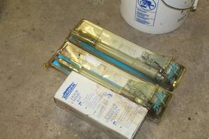 lot 190 image: Lot of (3) Door Accessories - Wright Door Closers (x2), Broan Door Chime Kit (x1) (in package)