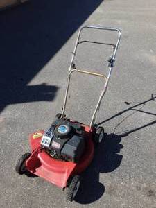 lot 7 image: Toro 2-Cycle Lawn Mower (Turns Over-No Gas To Test)