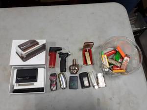 lot 27 image: Cigarette Roller, Lighters & More