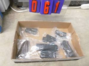 Box of misc gun parts, 1911 grips, ar dust covers. As shown.