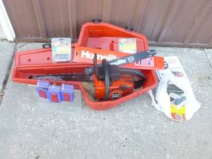 Homelite model 240 16 chainsaw. Includes extra bars & chains with case. As shown.