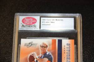 lot 64 image: 2002 Score QBC Materials John Elway #25 SCD Untouched