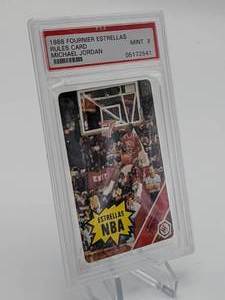 lot 20 image: Rare 1988 Fournier Estrellas Rules Card Michael Jordan in the Original Wrapper PSA 9