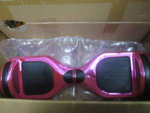 lot 9 image: 2 hoverboards 1 powers on and one d...