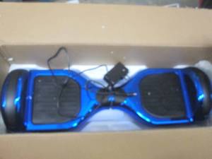 lot 34 image: hoverboard in blue chrome powers on...