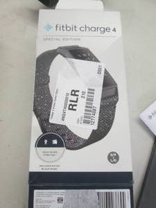 lot 73 image: fit bit charge 4 powers on ...