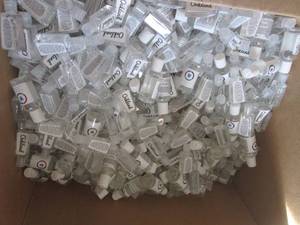lot 225 image: about a half full box of 2floz bott...
