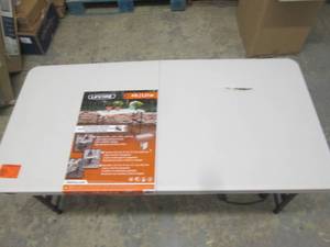 lot 235 image: 4 foot adjustable folding table has...