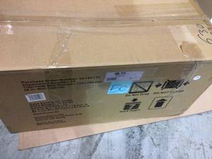 lot 50 image: Ready-to-Assemble 28 in. W x 29 in. H x 12 in. D Steel Garage Wall Cabinet in Black by Husky Customer Returns See Pictures 