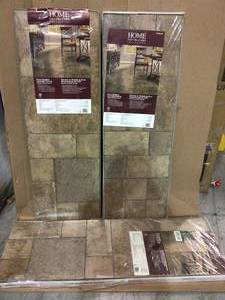 lot 61 image: Tuscan Stone Bronze 8 mm Thick x 15.5 in. Wide x 47-12 in. Length Click Lock Laminate Flooring (20.02 sq. ft.  case) by Home Decorators Collection Customer Returns See Pictures 