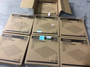lot 97 image: 18.4 in. x 18.4 in. Black PVC Garage Flooring Tile (6-Pack) by Husky Customer Returns See Pictures 