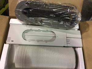 lot 23 image: 12,000 BTU (7,500 BTU, DOE) 115-Volt Portable Air Conditioner with Dehumidifier Function and LCD Remote  by LG Electronics Customer Returns See Pictures 