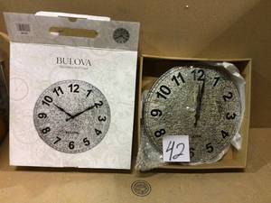 lot 42 image: IndoorOutdoor Cast Resin with Aged Stone Look 12 in. Round Wall Clock Customer Returns See Pictures 