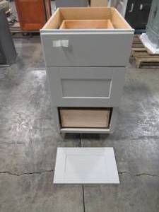 lot 212 image: Hampton Bay Shaker Assembled 18x34.5x24 in. Drawer Base Kitchen Cabinet with Ball-Bearing Drawer Glides in Dove Gray KDB18-SDV