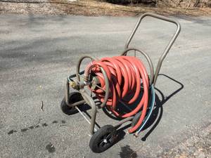 lot 379 image: Garden Hose Rolling Cart