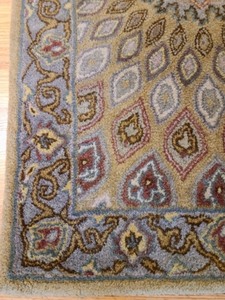 lot 22 image: Safavieh Wool Accent Rug