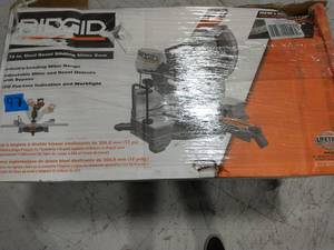lot 97 image: RIDGID 15 Amp Corded 12 in. Dual Bevel Sliding Miter Saw with 70 Deg. Miter Capacity and LED Cut Line Indicator