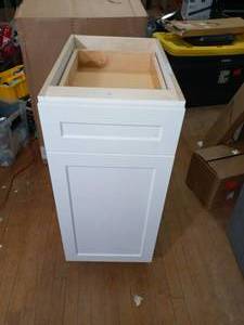 Designer Series Melvern Assembled 15x34.5x23.75 in. Pull Out Trash Can Base Kitchen Cabinet in White by Hampton Bay- open box not used   - SEE PICTURES