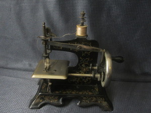 lot 103 image: Childs sewing machine, made in Ger...
