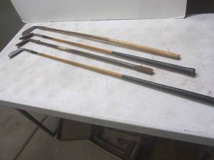 lot 195 image: Antique putters, wood handles...