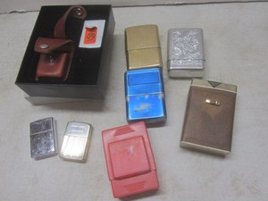 lot 215 image: Zippo lighter - one with box & leat...