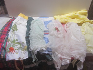 lot 260 image: Aprons including vintage hostess, ...