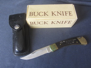 lot 361 image: Buck 110 knife, engraved safety awa...