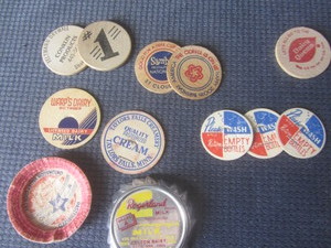 lot 380 image: Milk caps & tokens including Taylor...