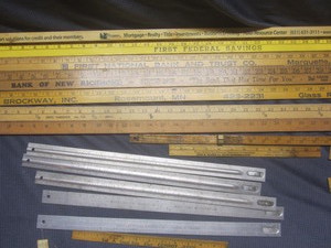 lot 491 image: Yard sticks & metal rulers - Olcott...