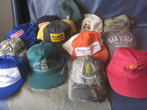 lot 413 image: Duffle bag, hats including Allis Ch...