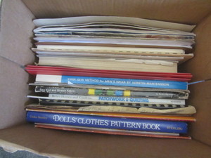 lot 434 image: Sewing books with dolls clothes, tw...