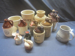 lot 445 image: Crock jugs with whiskey advertising...
