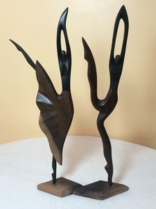 lot 134 image: Two Wood Carved Figurines and a Leather Moose Figurine