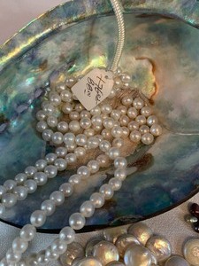 lot 223 image: Polished Shell and Strands of Pearls