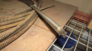lot 83 image: 100 Sewer Snake Cable With a Repaired Splice