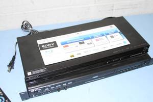 lot 44 image: API DV-330 Progressive Scan DVD  VCD  CDG  CD Karaoke Player & Sony Blu-Ray Disc Player with Remote Controls