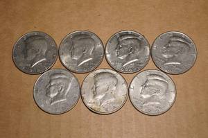 lot 10 image: 7 Kennedy Half Dollars