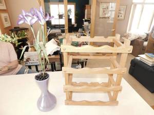 lot 56 image: Wood Wine Bottle Rack  Purple Vase with Artificial Purple Lilies