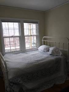 lot 170 image: Full Size Bed With White Metal Headboard and Footboard