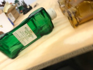 green cologne bottle