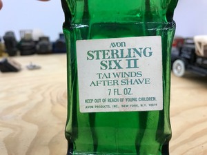 green cologne bottle