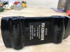 black vw cologne bottle
