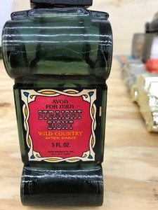 dark green glass cologne bottle